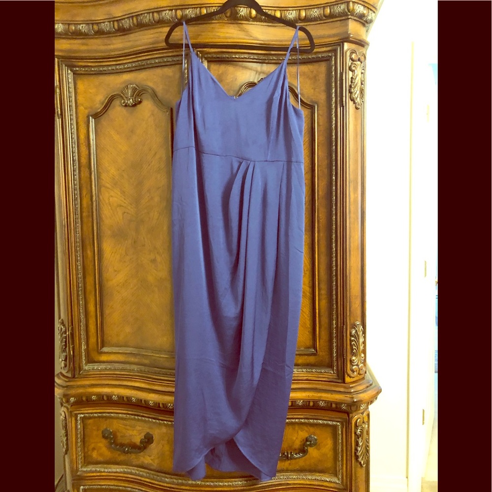 Purple spaghetti strap dress with a split.